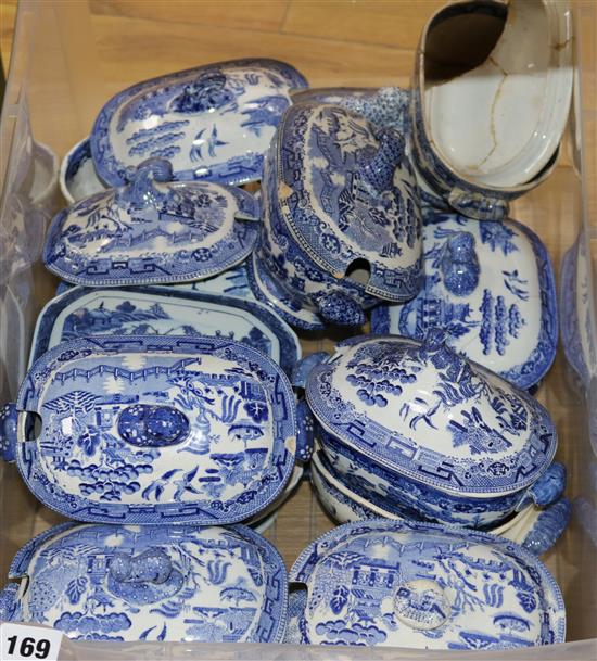 A collection of small blue and white tureens and covers